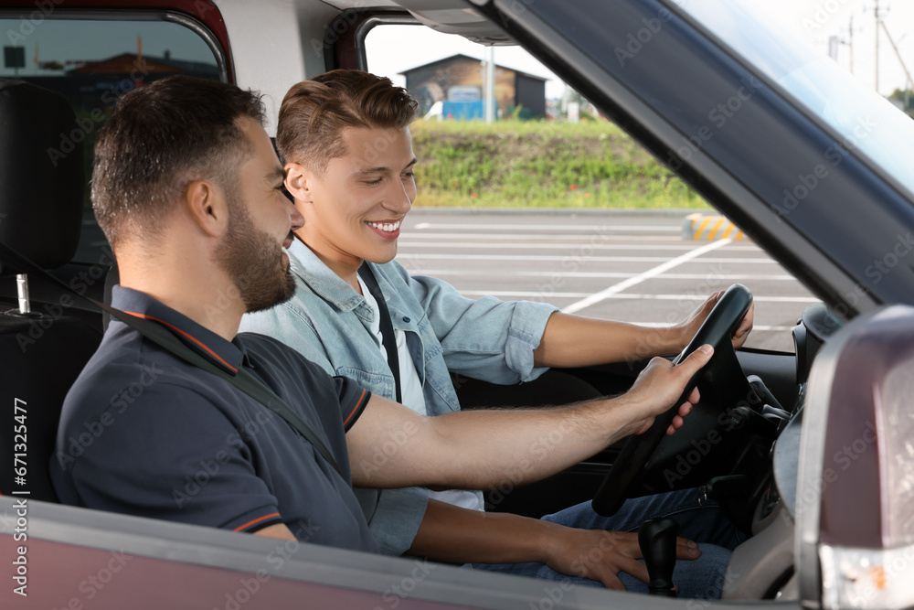 Driving instructor teaching a student